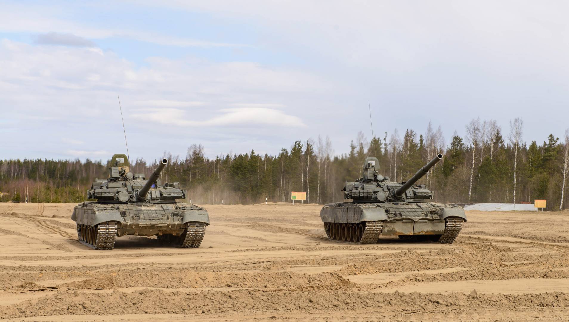 Tanks crossing open field