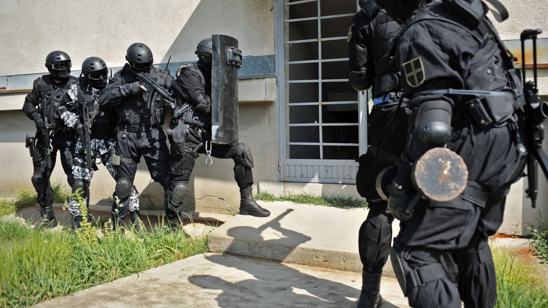 SWAT team getting ready to breach door